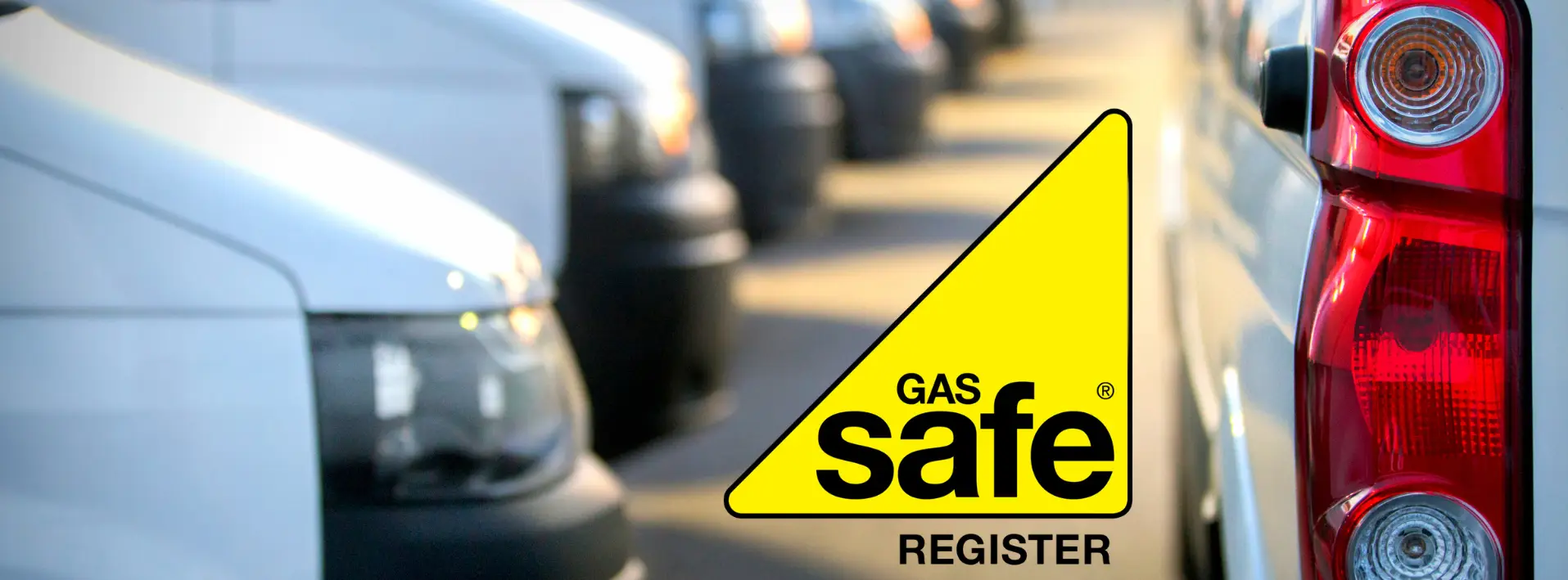 Gas Safe Register logo with yellow triangle displayed over fleet of white service vans